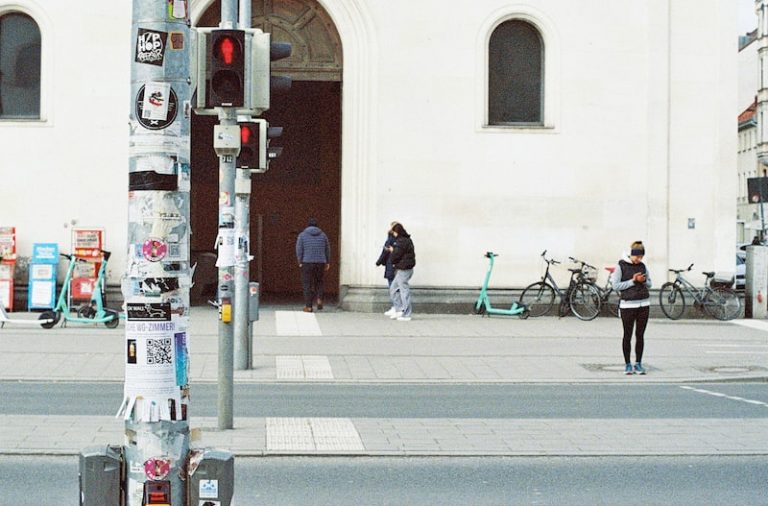 a parking meter sitting on the side of a street