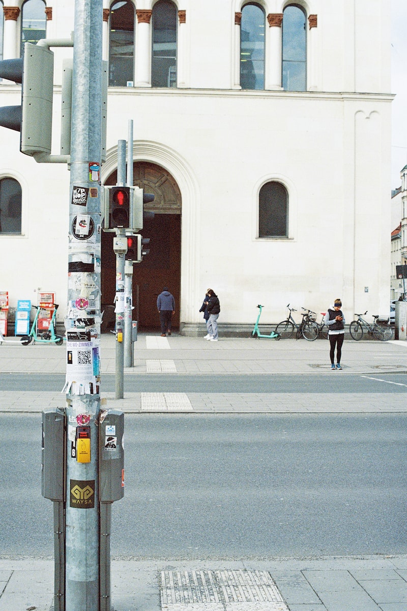 a parking meter sitting on the side of a street