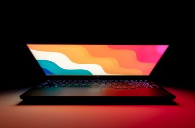 macbook pro on black table